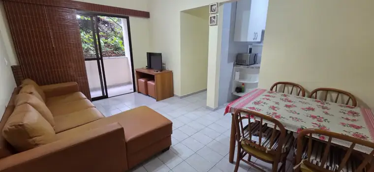 Apartamento no Sumaré — sala mobiliada com acesso à varanda